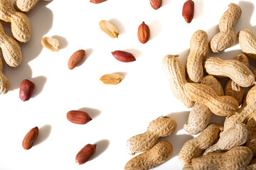 Peanuts in shell isolated on white background. Heap of peanuts close up