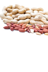 Peanuts in shell isolated on white background. Heap of peanuts close up