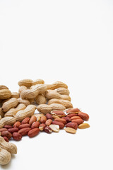 Peanuts in shell isolated on white background. Heap of peanuts close up