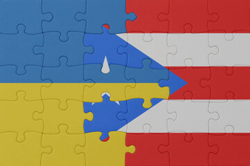 puzzle with the national flag of ukraine and puerto rico . macro.concept.
