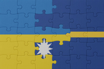 puzzle with the national flag of ukraine and Nauru . macro.concept.