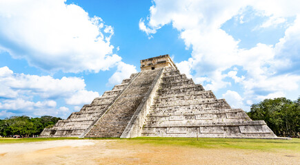 Wide from view of El Castillo landmark also knwn as Temple of Kukulcan at Chichen Itza structure...