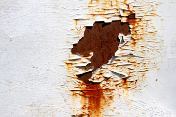 Rusted white painted metal wall. Rusty metal background with streaks of rust.