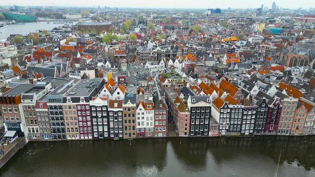 Aerial shot of Damrak canal houses in Amsterdam city center, Netherlands