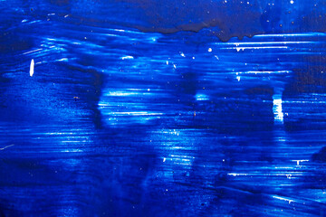 abstract blue background. paint streaks. blue metal. blue color texture.