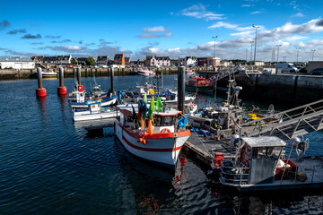 Fototapeta na wymiar Harbor And Fishing Boats Of Finistere City Guilvinec At The Coast Of Atlantic In Brittany, France