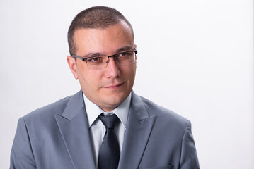 Close-up portrait of serious businessman isolated on white background