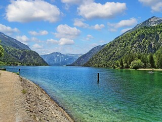 Beautiful landscape on Lake Achen (Achensee) in austrian (Tirol) alps on a summerday with blue sky, a few clouds and nature mountain view.