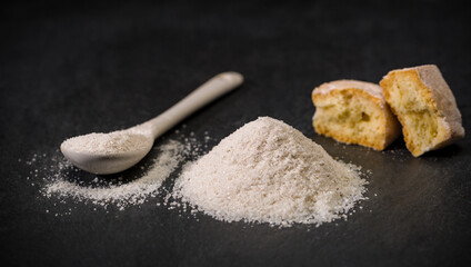 Spices for recipes. Milanese sugar. Spoon and pile of sugar, cookie or biscuit. Sweets. Ground spice