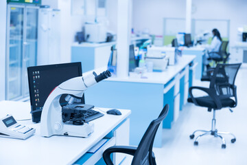 Selective focus microscope in laboratory unit.Modern medical research laboratory with microscopy on the desk.Health scientific lab biotechnology department center.Medical healthcare technology concept