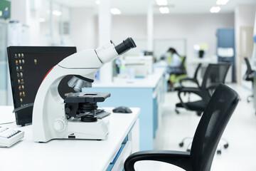 Selective focus microscope in laboratory unit.Modern medical research laboratory with microscopy on the desk.Health scientific lab biotechnology department center.Medical healthcare technology concept