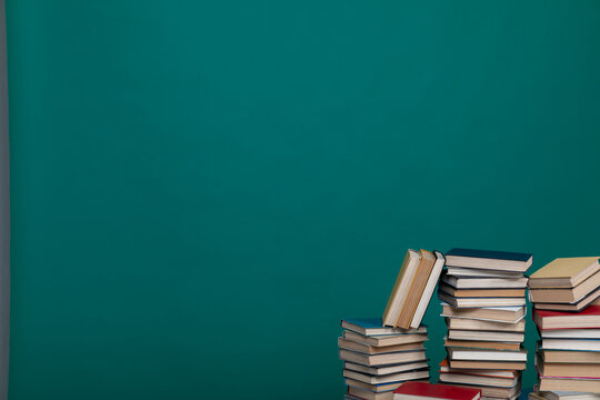 stack of books on a green background in the learning library