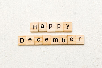 Happy december word written on wood block. Happy december text on table, concept
