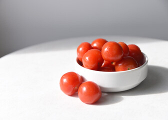 Cherry tomatoes in a white bowl