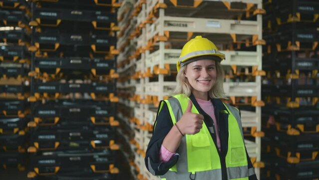 Portrait of worker in an auto parts warehouse, Relax after examine auto parts that are ready to be shipped to the automobile assembly factory.