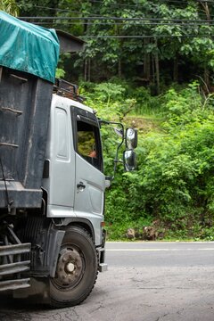 a photograph of a truck on the road in a exotic location