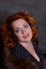 Young girl sit, and look up in camera. High quality photo