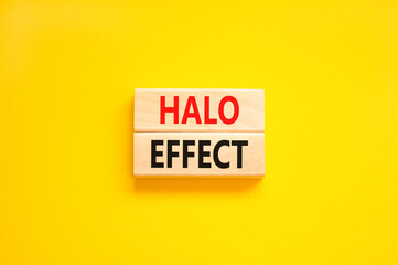 Halo effect and psychological symbol. Concept words Halo effect on beautiful wooden block. Beautiful yellow table yellow background. Business psychological and Halo effect concept. Copy space.