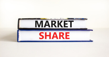 Market share symbol. Concept words Market share on beautiful books. Beautiful white table white background. Business and Market share concept. Copy space.
