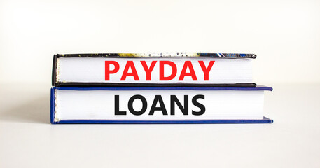 Payday loans symbol. Concept words Payday loans on beautiful books. Beautiful white table white background. Business and Payday loans concept. Copy space.
