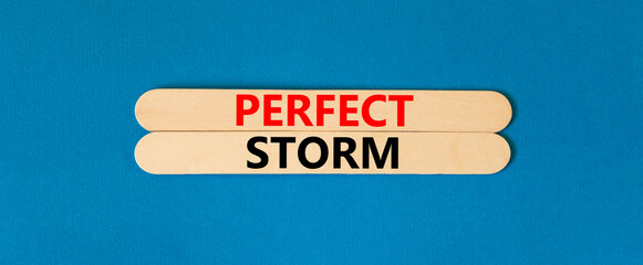 Perfect storm symbol. Concept words Perfect storm on beautiful wooden stick. Beautiful blue table...