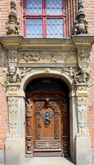 Decorative entrance to the rich merchant house in medieval Gdansk Poland