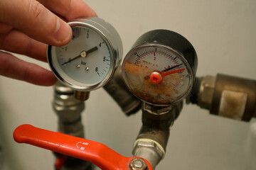 Damaged and good manometer. Plumping servise. Bad pressure gauge in the pipeline. Metallic pressure...