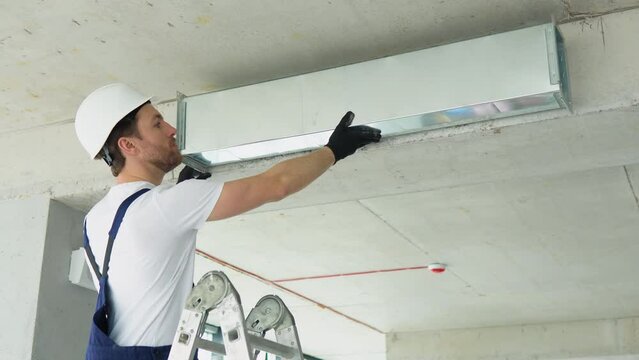 Hvac worker install ducted pipe system for ventilation and air conditioning