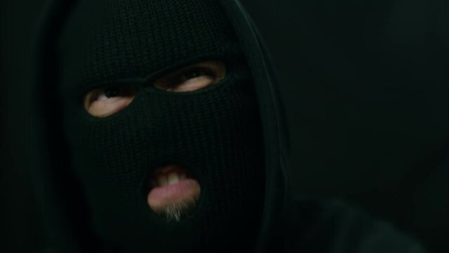 Latino Male Criminal Shouts and Points Past Camera. Shot with ARRI Alexa in ARRIRAW and exported QuickTime Apple ProRes 422 HQ.