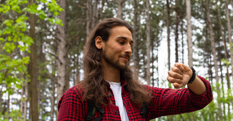 Long hair man in forest