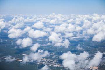 An airplane view of clouds symbolizes freedom, imagination, and perspective. The vast expanse of the sky inspires awe and wonder, offering a sense of detachment from the daily grind 