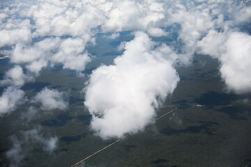An airplane view of clouds symbolizes freedom, imagination, and perspective. The vast expanse of the sky inspires awe and wonder, offering a sense of detachment from the daily grind 