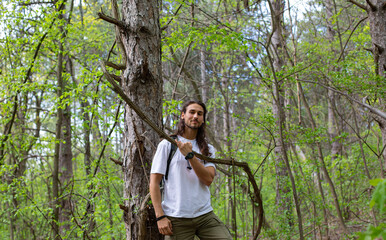 Long hair man in forest