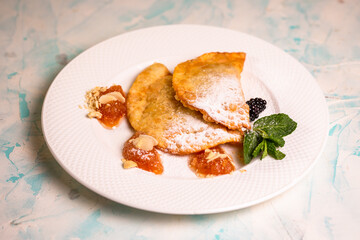 sweet berry cheburek with jam, ice cream and strawberries