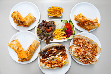 Lavash doner kebab ( zurna doner durum )  or shawarma sliced in plate isolated. 