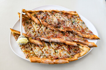 Kiymali pide. Turkish pide with minced meat. Turkish pizza mince pita Pide on white background. Etli ekmek. Kusbasi kasarli pide.