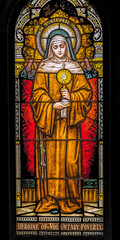 Saint Clare of Assisi stained glass, Phoenix, Arizona. Annunciation angel, follower of Saint Francis. - obrazy, fototapety, plakaty