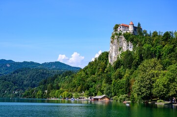 Fototapeta na wymiar Beautiful idyllic view on island, castle, catholic Maria church in lake Bled. Slovenia