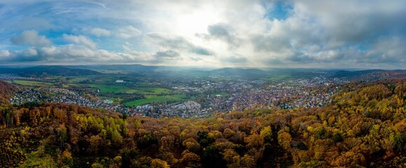 Aerial panorama on town Gelnhausen, Marienkirche chuch, cloudy sky, yellow trees. Hesse, Hessen, Germany
