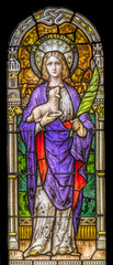 Fototapeta na wymiar Saint Agnes stained glass, Phoenix, Arizona. Saint Agnes, Roman martyr died as young girl for faith. Church rebuilt stained glass 1915