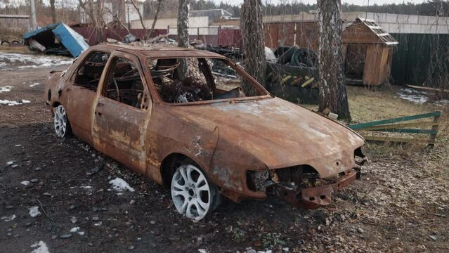 damage car, destruction city, shrapnel and burnt. Car destroyed in missile attack, civilian vehicle destroyed in missile attack, ukraine war, russian invasion, car burnt out, ruins of city
