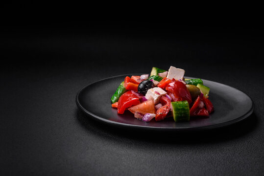 Delicious, fresh Greek salad with feta cheese, olives, tomatoes and cucumbers