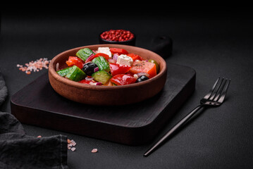 Delicious, fresh Greek salad with feta cheese, olives, tomatoes and cucumbers