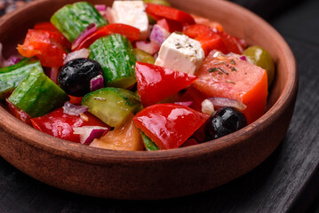 Delicious, fresh Greek salad with feta cheese, olives, tomatoes and cucumbers