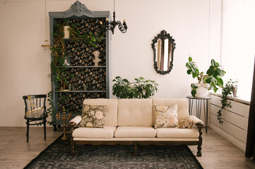 Classic interior, with wooden sofa, vintage sideboard, mirror and flowers