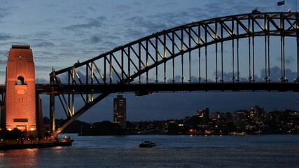 Sydney Harbour Bridge-arch and pylon-viewed from the Opera House at twilight under floodlight. NSW-Australia-586