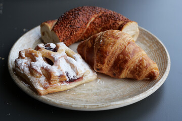 fresh crispy croissant on plate 