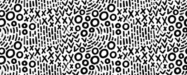 Doodle geometric seamless pattern with crosses, circles and dashes. Vector black and white brush strokes. Simple childish scribble wallpaper. Expressive seamless abstract geometric background.