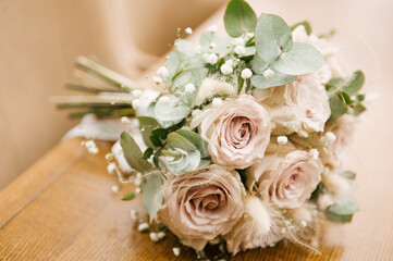 The bride's bouquet and the beautiful details of the bride's morning