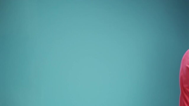 So what to do in this situation I dont know. latin spanish man with beard wearing shrugging shoulders, spreads palms feels unaware. Indoor studio isolated on blue background.